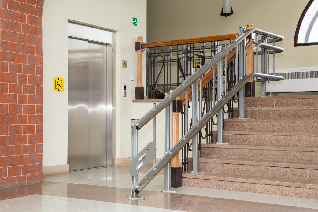 Stair lift for the disabled. Stairs of public building.